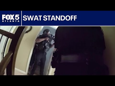 Officer grazed by bullet, suspect arrested after standoff