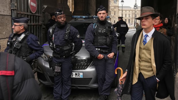 Turns out 'Fedora Man' in viral Louvre heist photo isn't AI