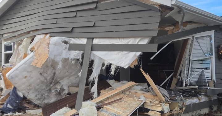 Woman killed after car pursued by MHP crashes into house