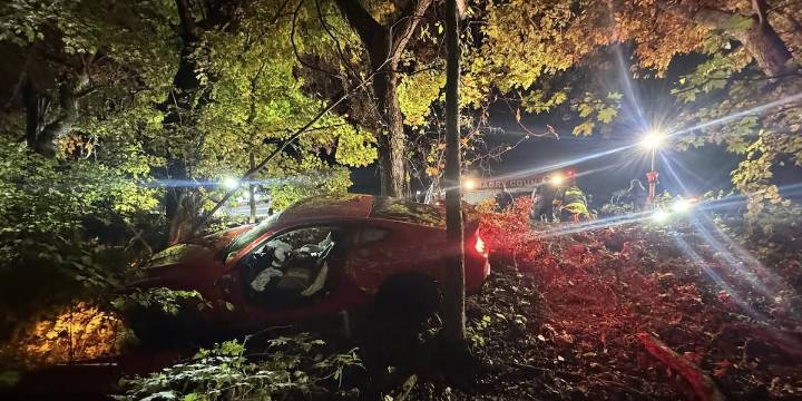Firefighters rescue driver from car dangling over steep embankment after Middle Tennessee crash