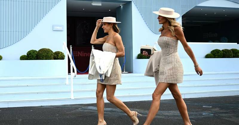 Rain no dampener for Melbourne Cup crowd spirits