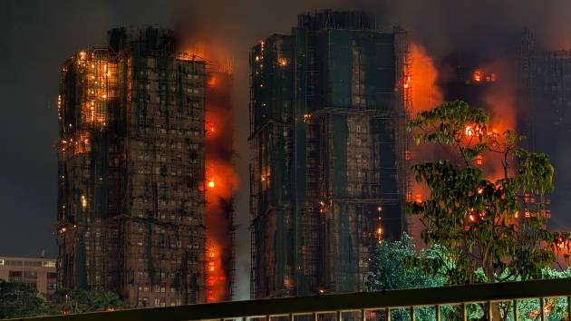 At least 13 dead as massive fire engulfs Hong Kong high