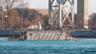 Watch homemade Canadian houseboat float along St. Clair River