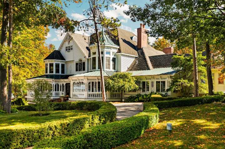 $8.99M Michigan lake house features hidden rooms, expert woodwork and gazebo with a loft