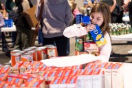 VolunTOTS kids lead the way in Thanksgiving meal packing