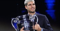 Carlos Alcaraz beams with pride as he lifts trophy for year