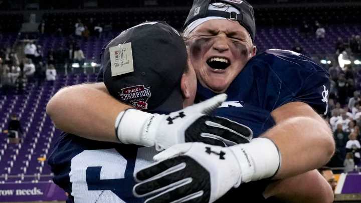 See Iowa high school football players celebrate 2025 state titles