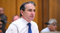 Commonwealth Bank of Australia's Matt Comyn calls for lower migration level as Warren Hogan demands a 'pull back'