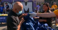 Volunteers give backpacks full of essentials to Skid Row community