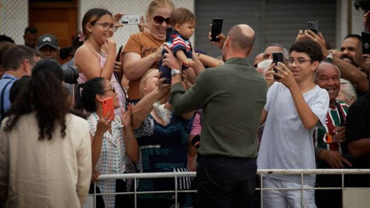 Prince William wins hearts as he cuddles baby handed to him on Brazilian island