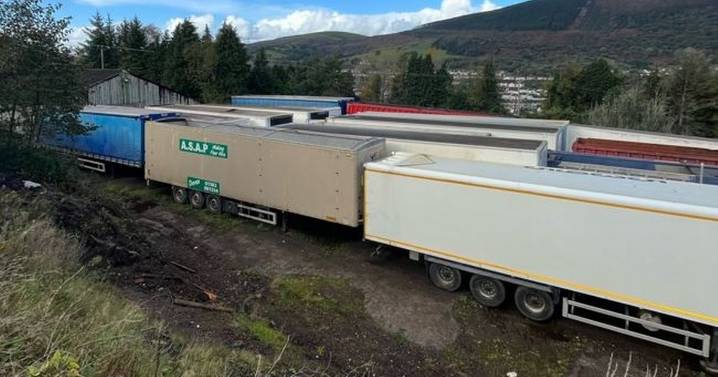 It looked like a graveyard for old lorry trailers, then police peered inside