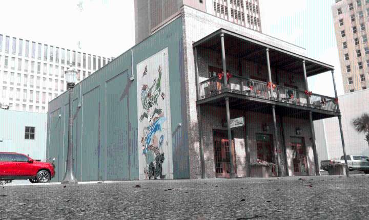 International artist unveils mural in downtown Mobile