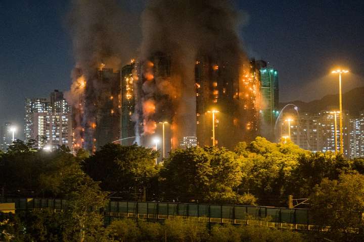 Deadly fire engulfs multiple apartment blocks in Hong Kong