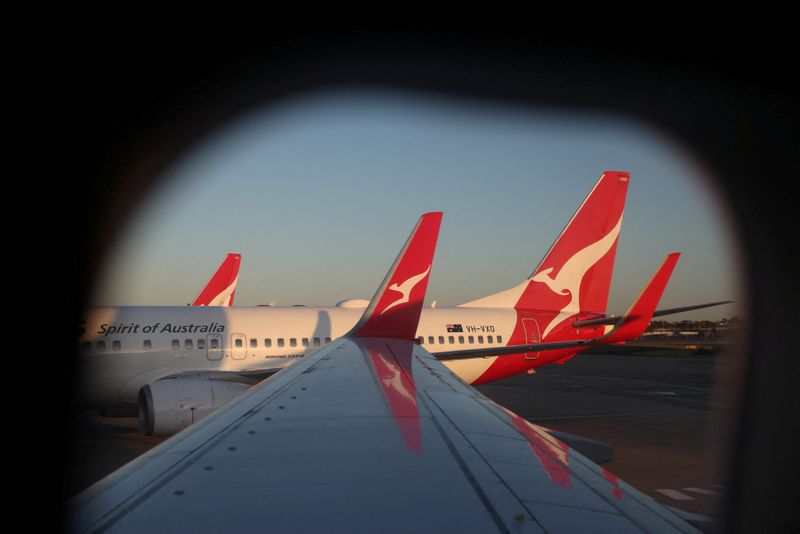 Qantas cuts first-half domestic revenue forecast, citing softer travel demand