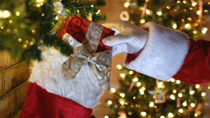 This Genius Dollar Tree Broom Hack Makes The Cutest Christmas Stocking Holder