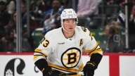 Bruins' Charlie McAvoy injured after getting puck in face