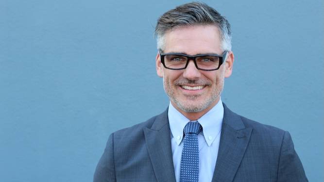 Middle-aged man still wearing blue because blue is for boys