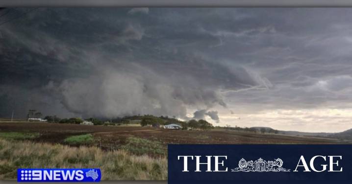 Large hail and lightning hit Queensland as residents brace for severe storms