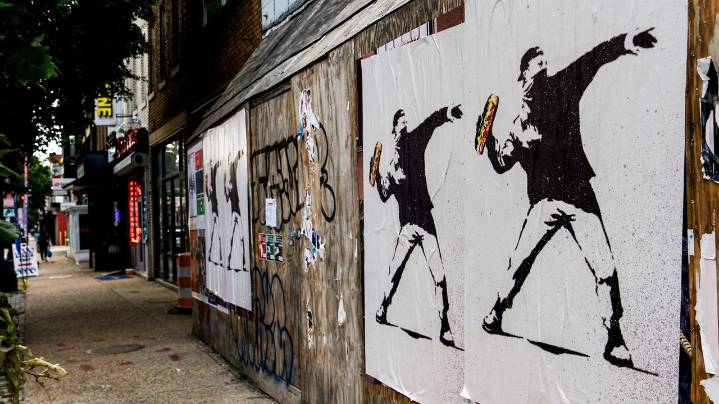 The man who threw a sandwich at a federal agent says it was a protest. Prosecutors say it's a crime