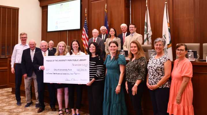 Friends of UP Public Library Present Check to City Council