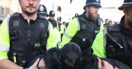 Police explain 30 arrests for holding up signs in Bristol