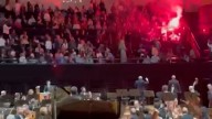 Protesters light flares at Israeli Orchestra concert