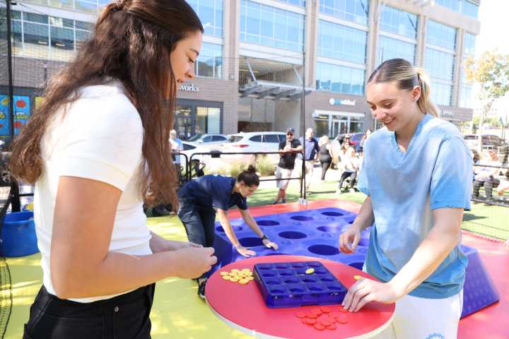 Paige Bueckers and Maddy Siegrest Have A Blast Playing Connect 4 at Hasbro Game Zone