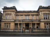 Albanian accused of chasing police with chainsaw not offered interpreter