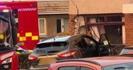 Car smashes into house in Scottish town as police tape off street