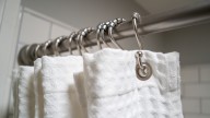 7 Shower Curtain Materials To Try (& The Best Way To Clean Them)
