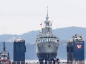 Massive floating dry dock moves HMCS Vancouver to Esquimalt for inspection