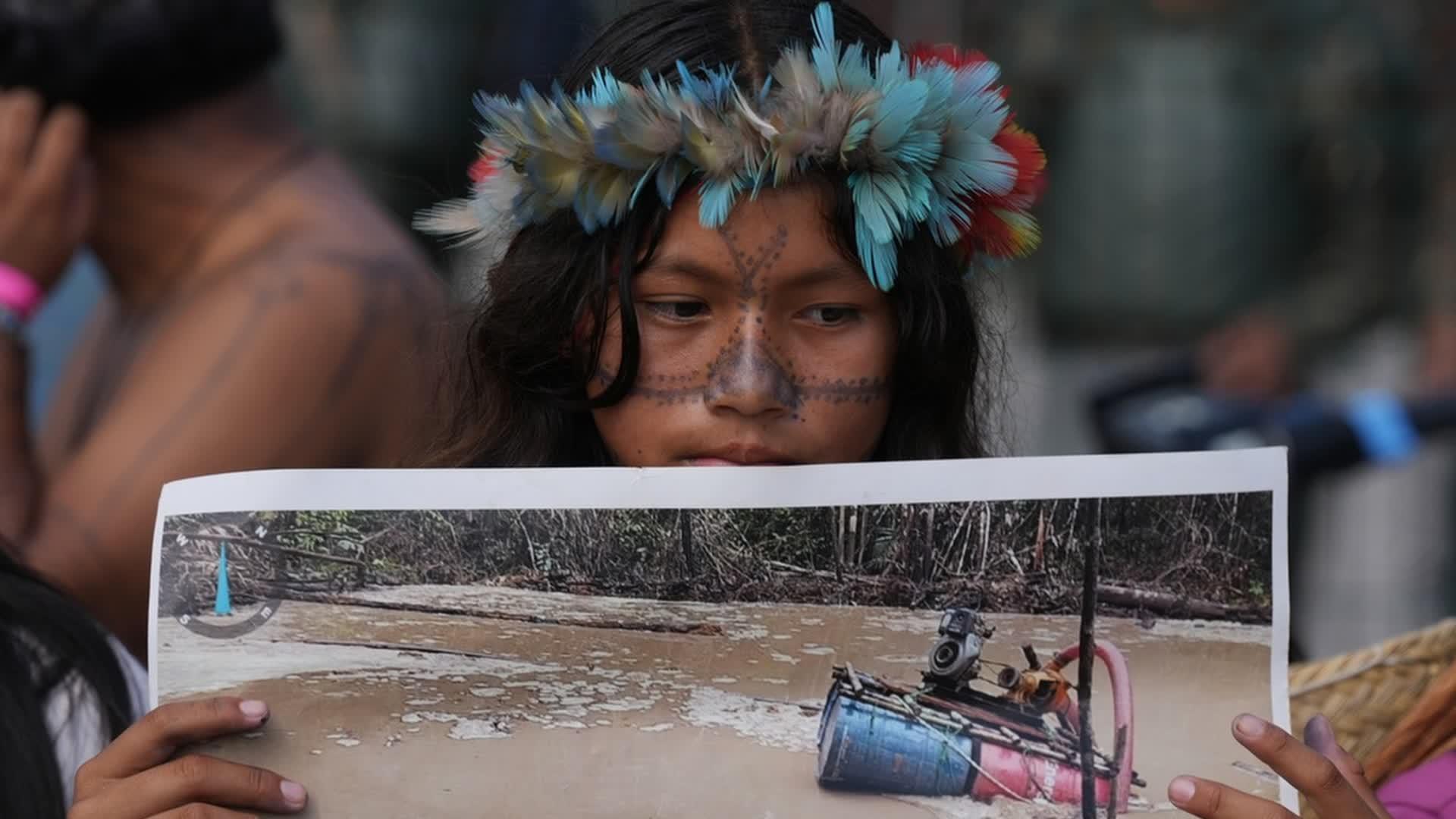 Protesters block the main entrance to COP30 climate talks in Brazil