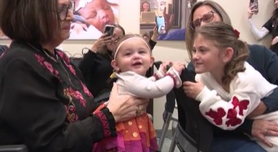 Edmond infant hears for the first time through hearing device