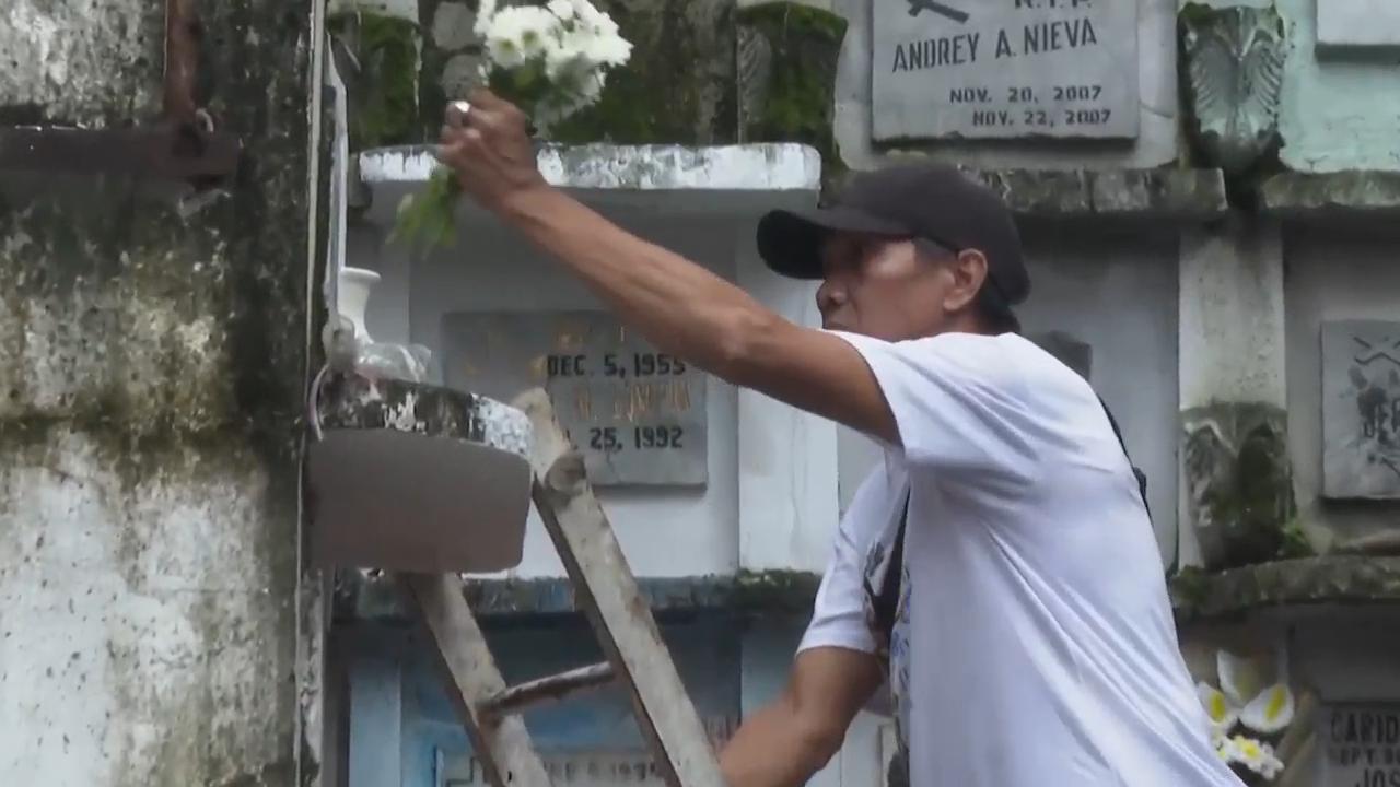 Millions across the Philippines visit the tombs of their loved ones to mark All Saints' Day