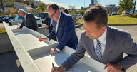 WVU leaders sign final steel beam, creating 'time capsule' for new $233 million Eye Institute