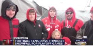 Football fans endure snowy weather for playoff games