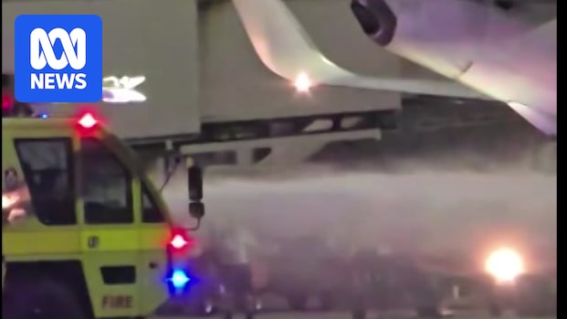 Firefighters extinguish brake fire on Virgin Australia plane after landing at Brisbane Airport