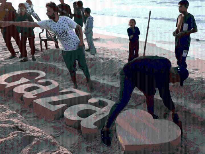 Palestinian sculptors create art on Gaza beach sand to escape Israel’s war