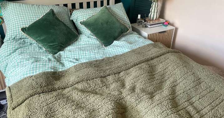 'Dunelm's £40 heated throw has become my secret weapon for cold nights and period pain'