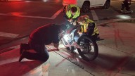 2 juveniles hospitalized after being hit by car while riding electric motorcycle