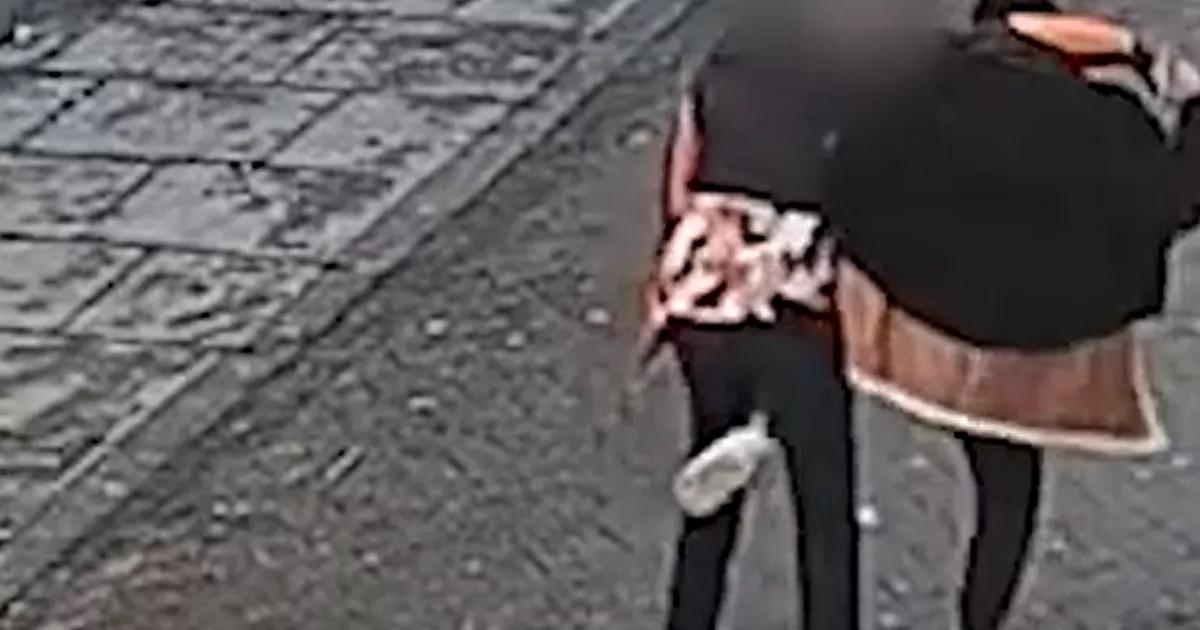Moment thief performs bizarre dance before stealing man's mobile phone