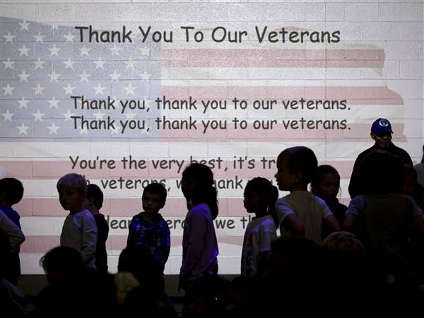 ‘So scared I could taste it’: Veterans share stories of service with Perrysburg students