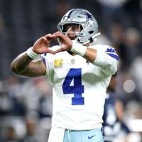 Grieving Cowboys remember Kneeland, defeat Raiders