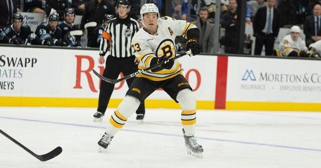 Bruins' Charlie McAvoy exits game against Canadiens after receiving shot to face