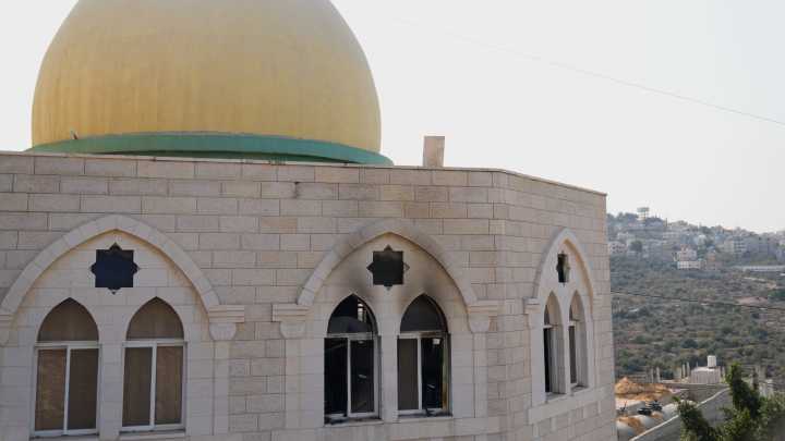 Israeli settlers torch a mosque and scrawl hateful messages after condemnation from military leaders