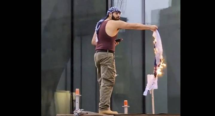 Man charged in crashing Jewish event also arrested for flag burning