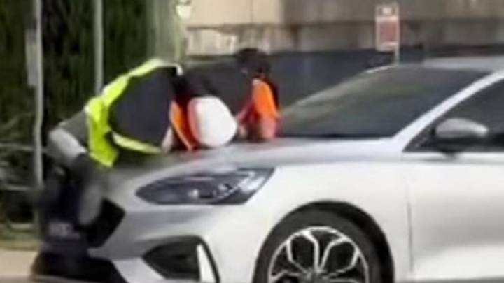 Shock footage shows young man clinging to the bonnet of a car in apparent Sydney road rage meltdown
