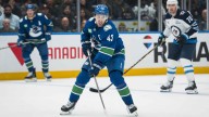 Canucks’ Quinn Hughes suffers injury scare during Jets game