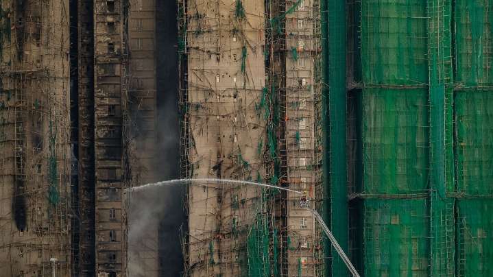 Fire that killed at least 44 burns in Hong Kong towers for a second day