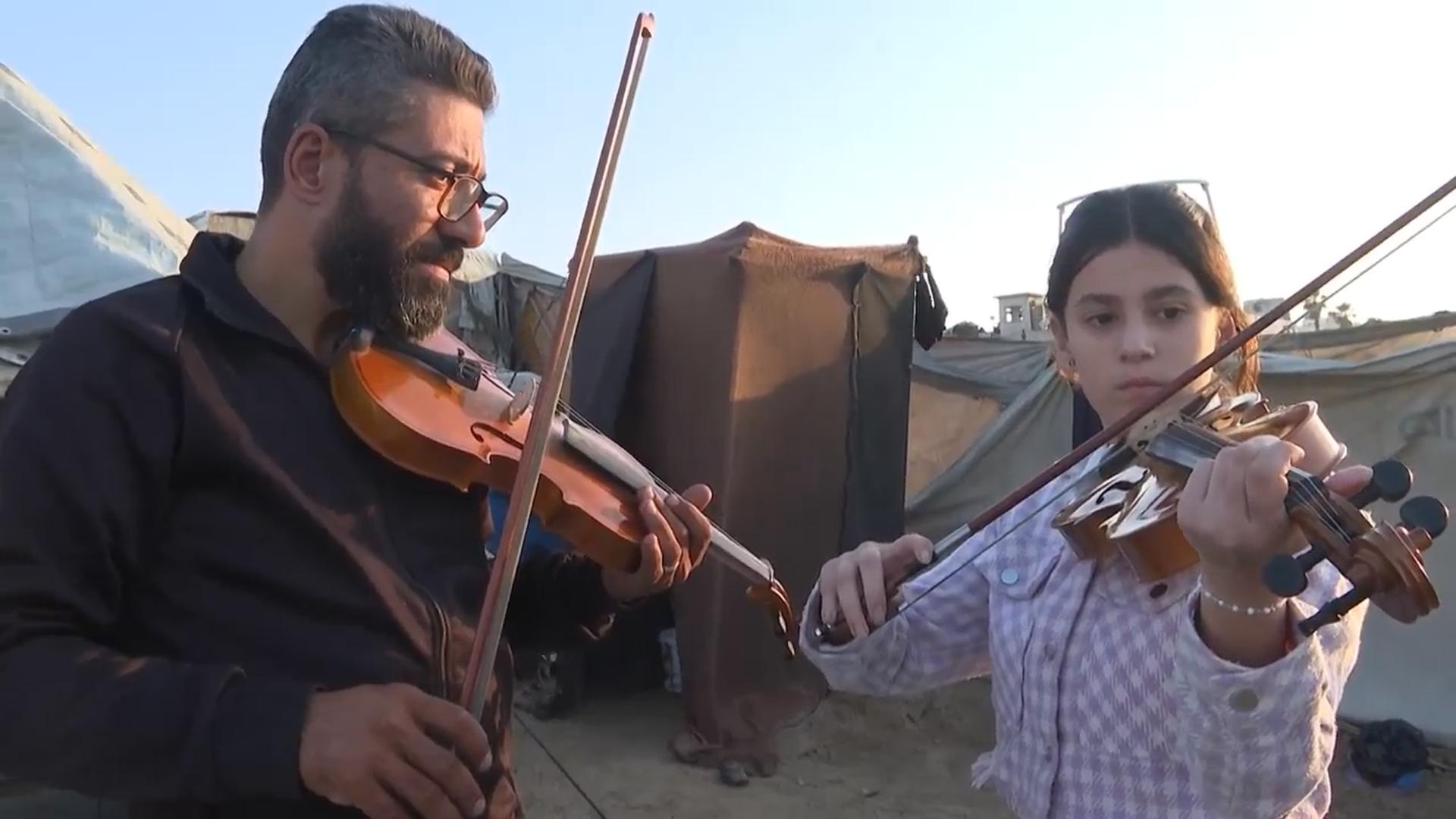 Amid the rubble of Gaza, tent camp children learn to escape through music